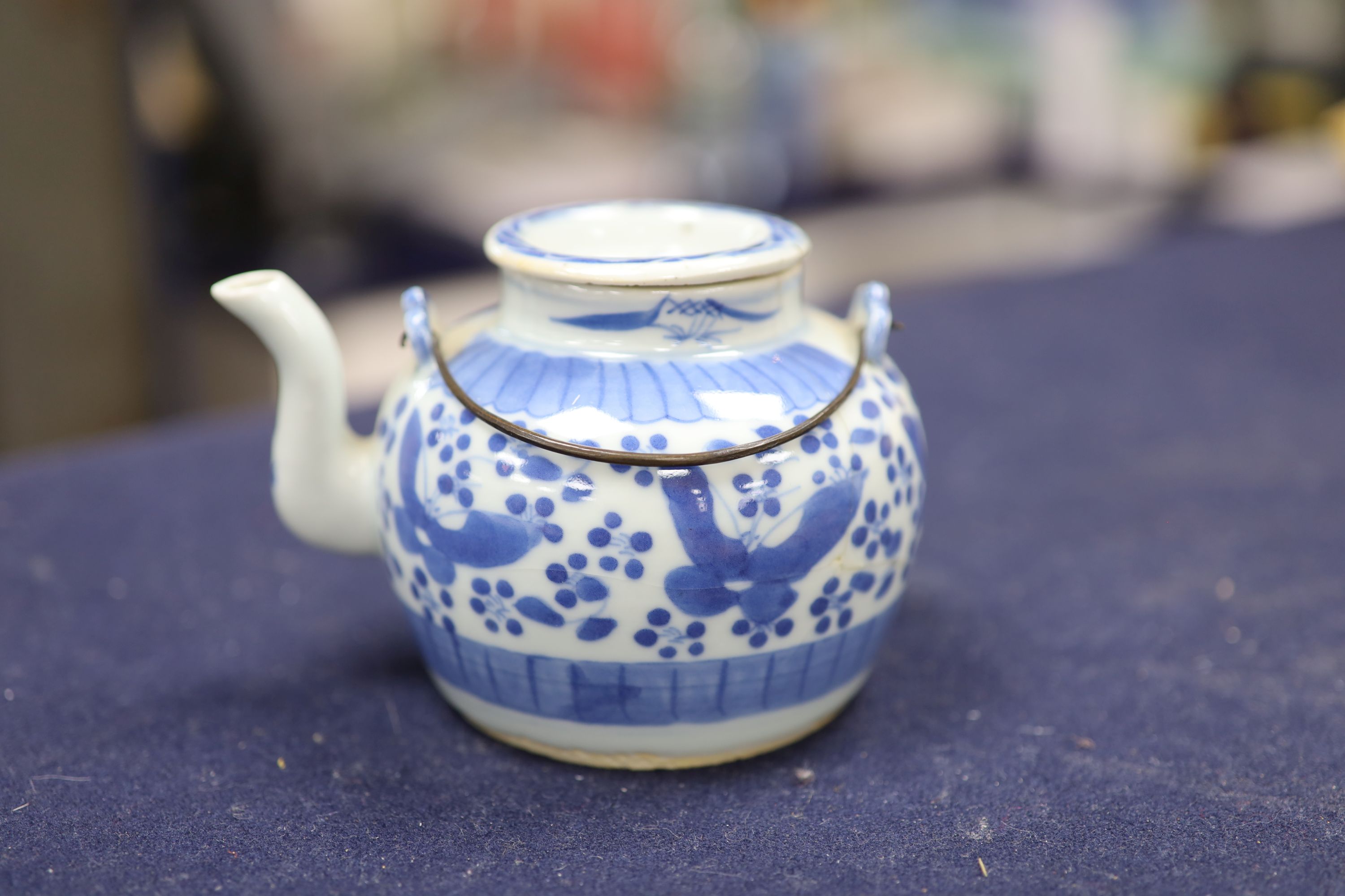 Two 19th century Chinese blue and white moon flasks and a teapot, tallest 21cm